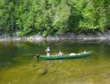 these guys are flyfishing for salmon and sea trouts from a canoe on the cascapedia river in the baie des chaleurs area of Gaspe peninsula in eastern Quebec